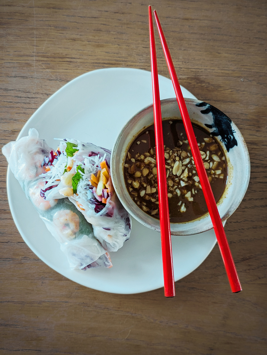 Asian Summer Rolls, chopsticks and Hoisin dipping sauce. 
